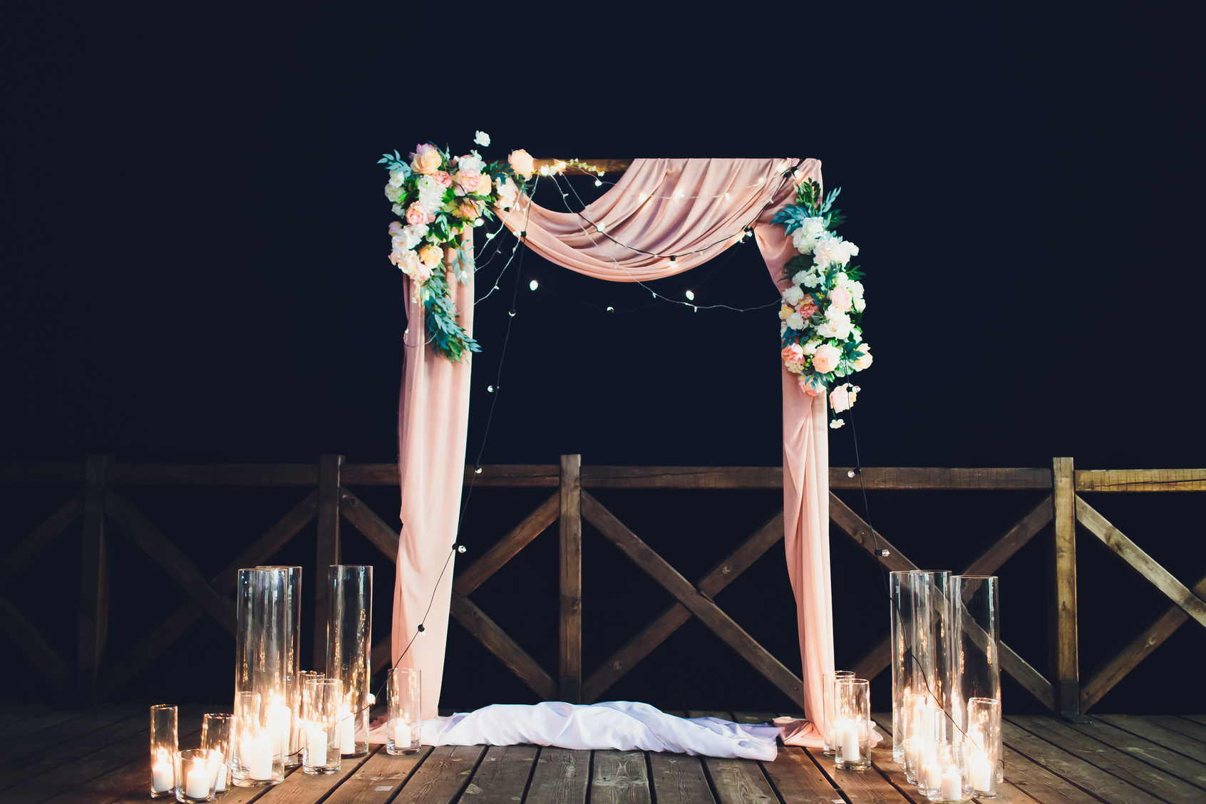 Wedding arch for wedding ceremony. Beautiful wedding decor in rustic style.